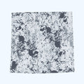 A square scarf featuring a distressed, grunge-style abstract pattern in black and off-white.